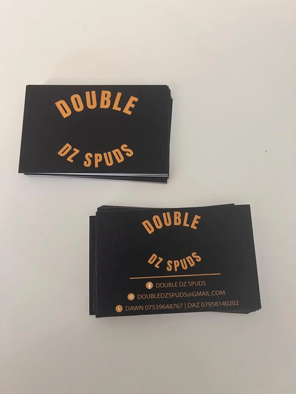 Black and orange takeaway business cards for food brand